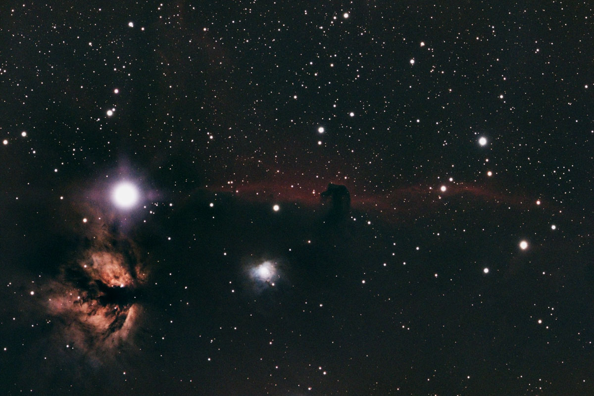 The Horsehead and Flame nebulae along with the bright star Alnitak