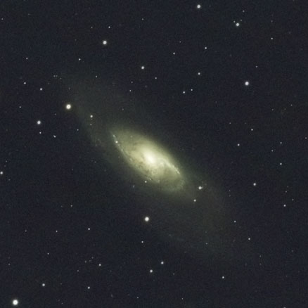 The giant spiral galaxy M106 looks relatively small in the top-centre of this image, with the six other visible galaxies appearing smaller still at their immense distances from us