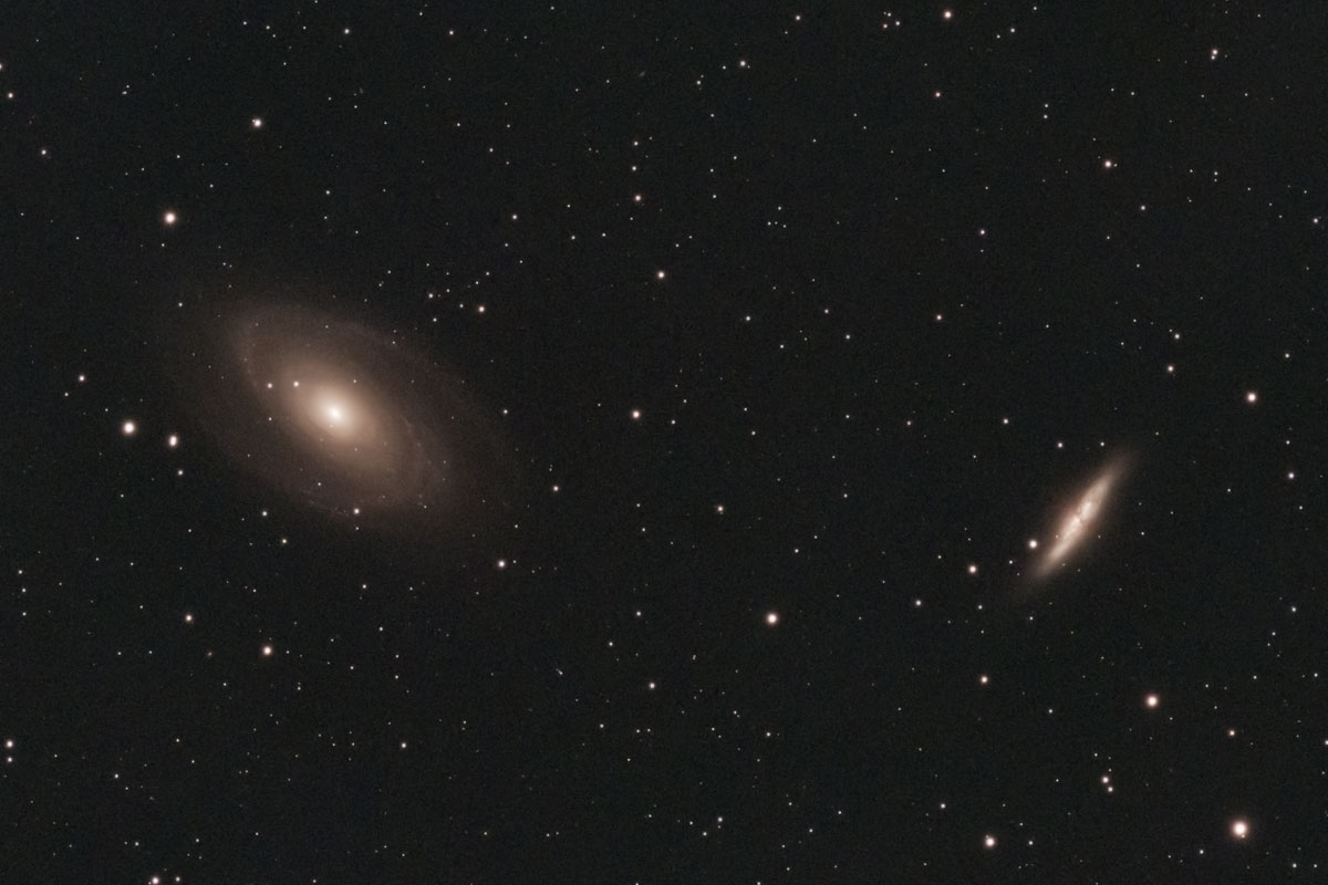 The elegant spiral of Bode's galaxy, alongside the smaller, appropriately-named Cigar galaxy