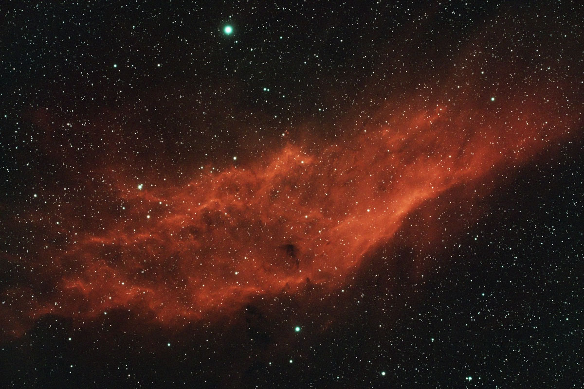 The California nebula, shaped somewhat like the state it is named after, appears quite orange in colour here